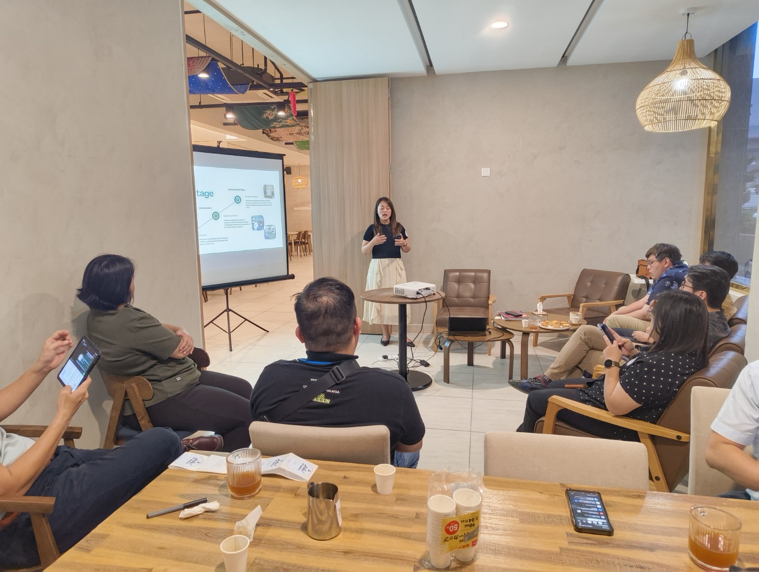 Speaker sharing with business owners at a café session