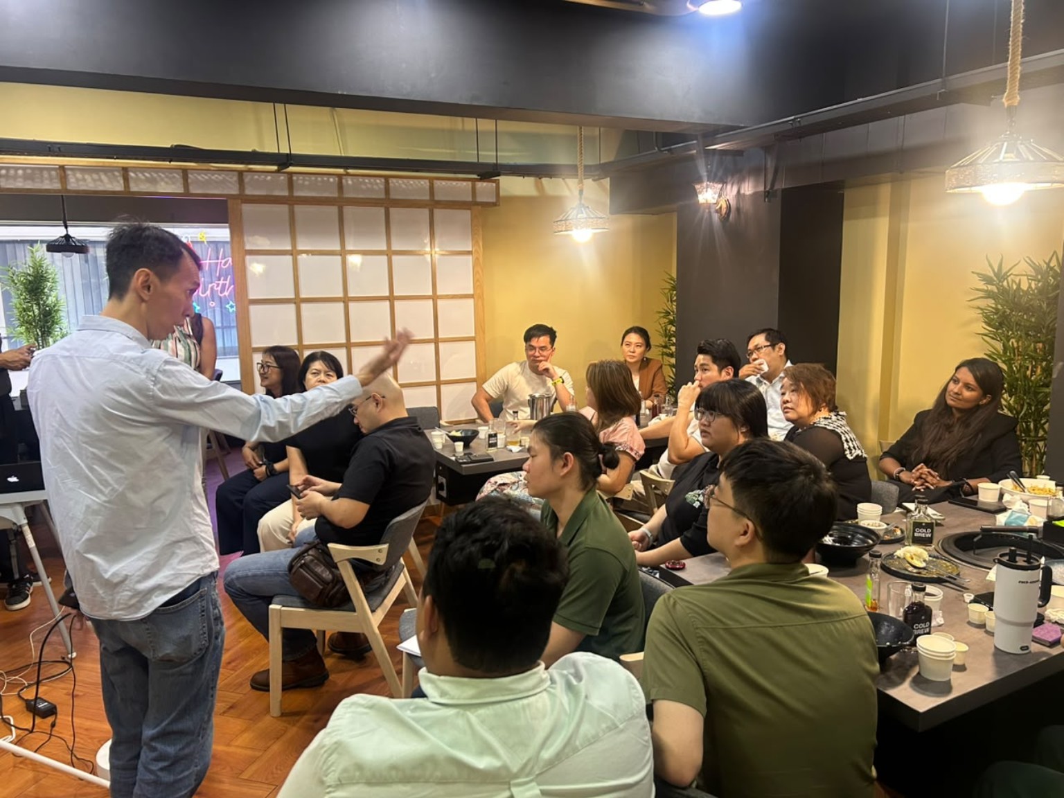 Speaker engaging entrepreneurs during a café meetup